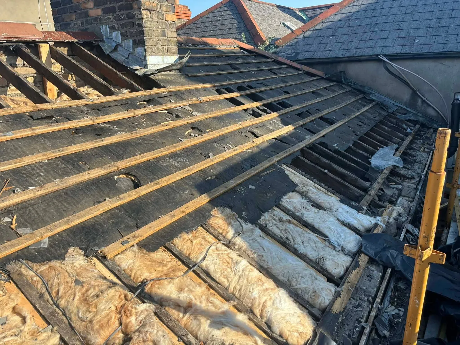 Old battens and insulation being cleared from the Ranelagh roof