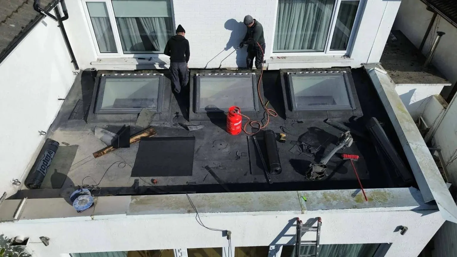 Torching on the felt around the rooflights in Blackrock