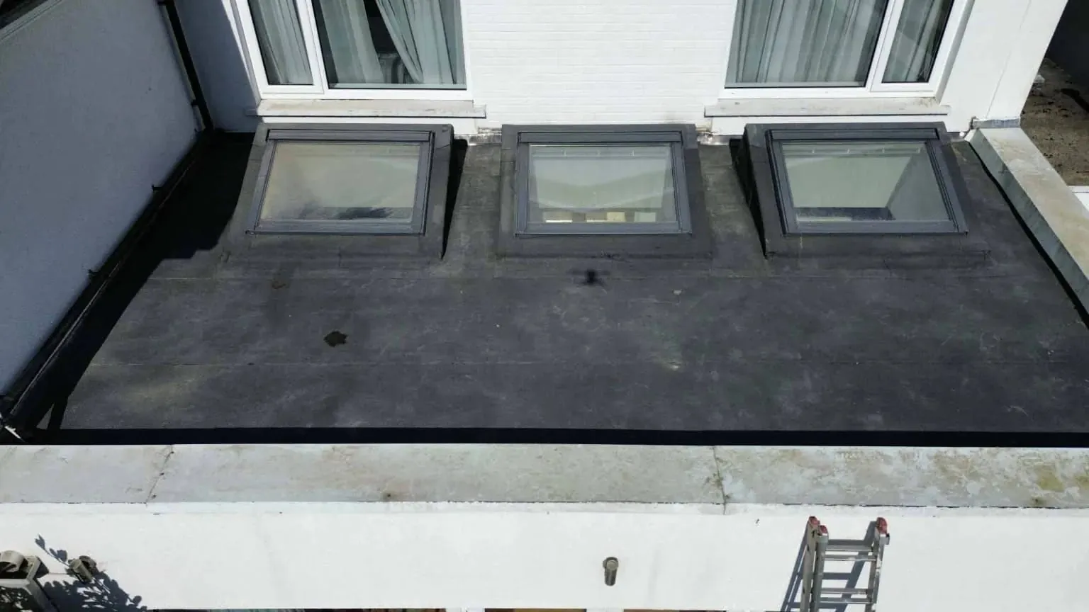 Three rooflights sealed into the new felt roof, Blackrock